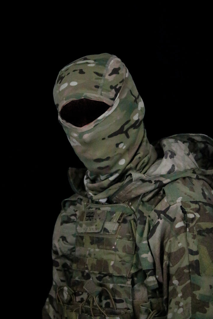 MULTICAM 2-in-1 balaclava worn with the hood deployed over a MULTICAM plate carrier